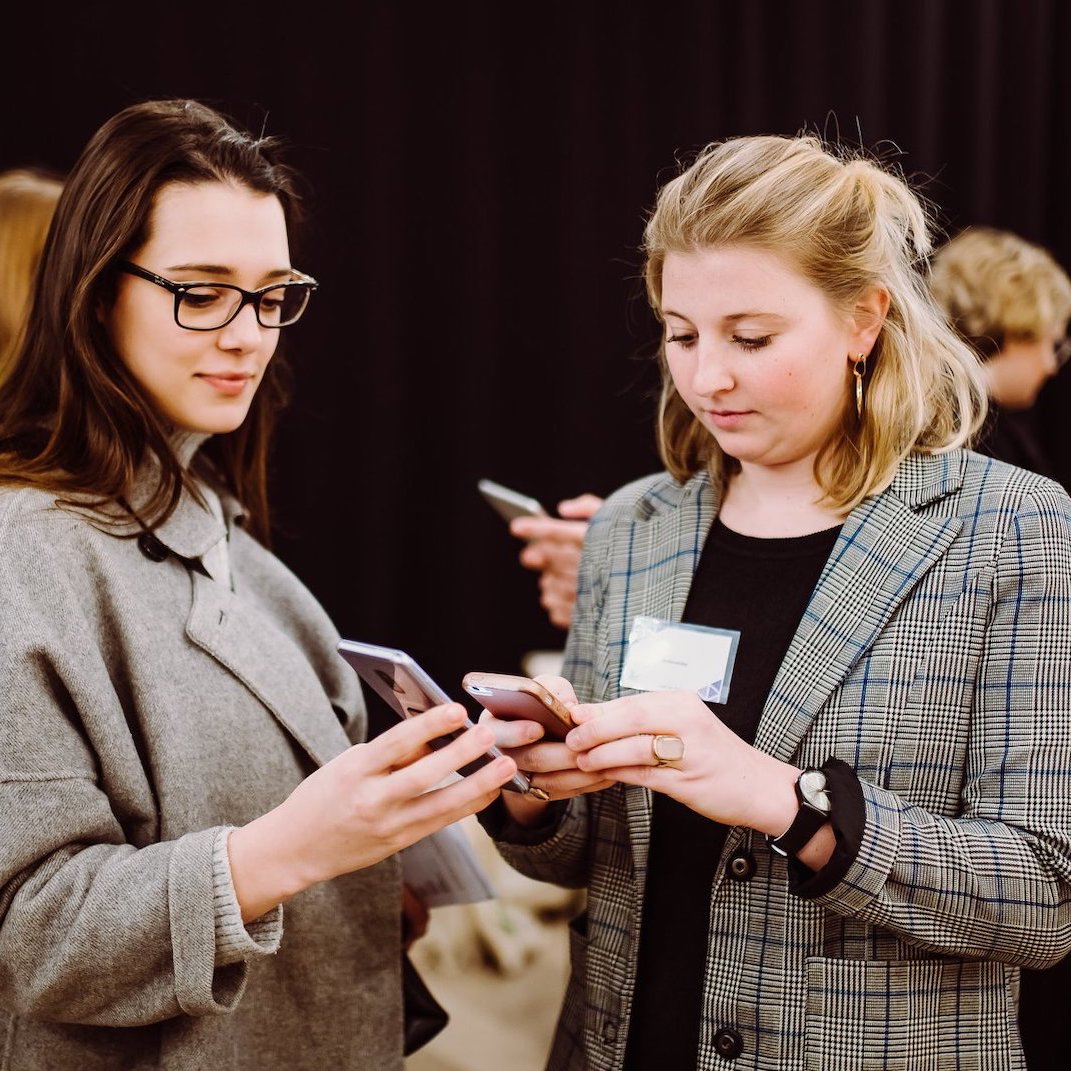 Scanning a QR code at a career fair